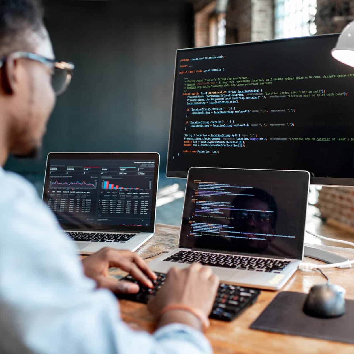 Man coding on a computer