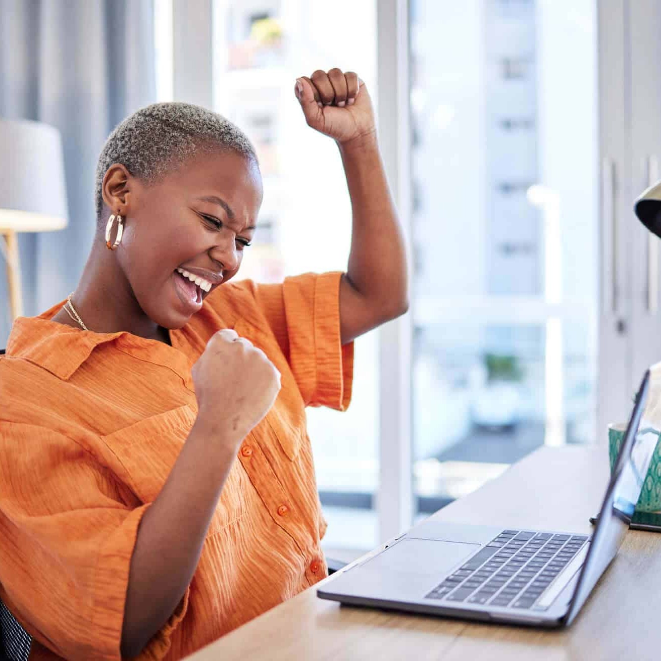 Happy woman on a laptop