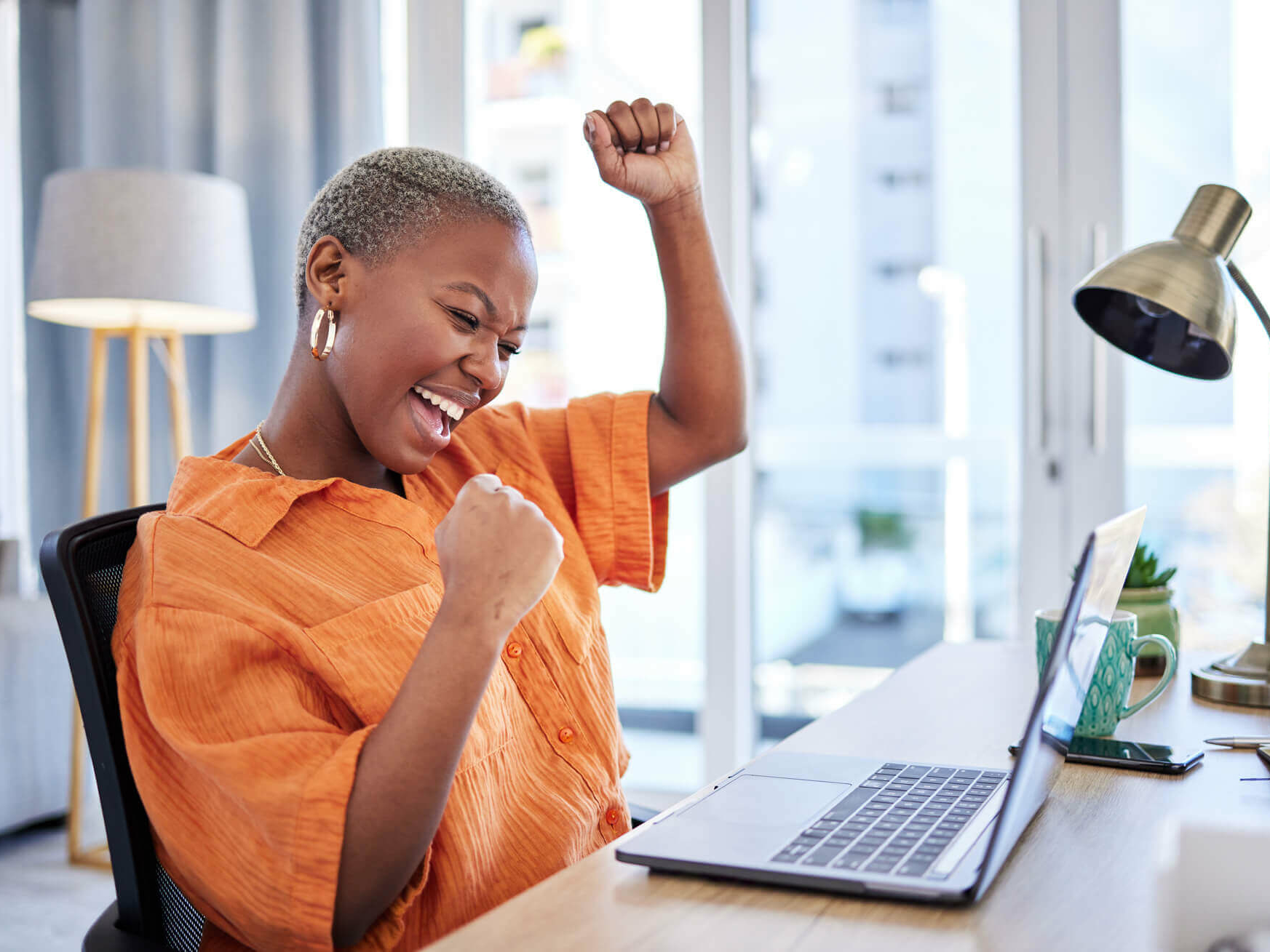 Happy woman on a laptop