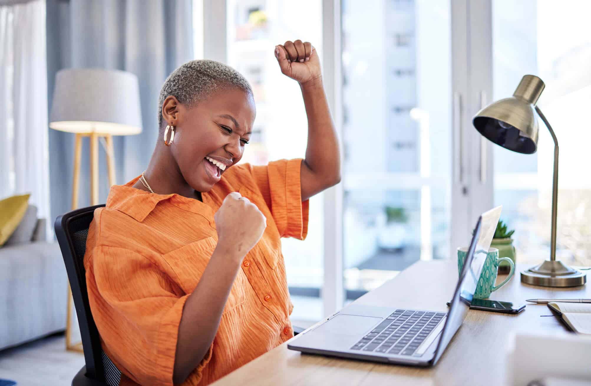 Happy woman on a laptop