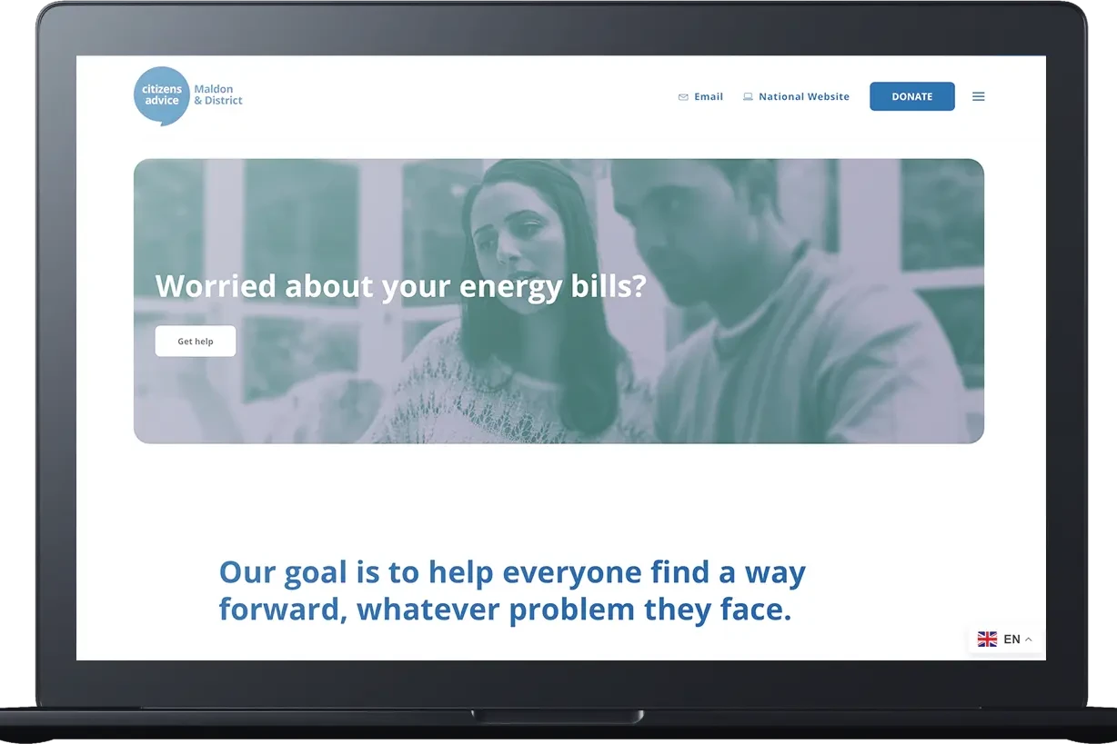 A laptop screen displays a Citizens Advice Bureau webpage with the text