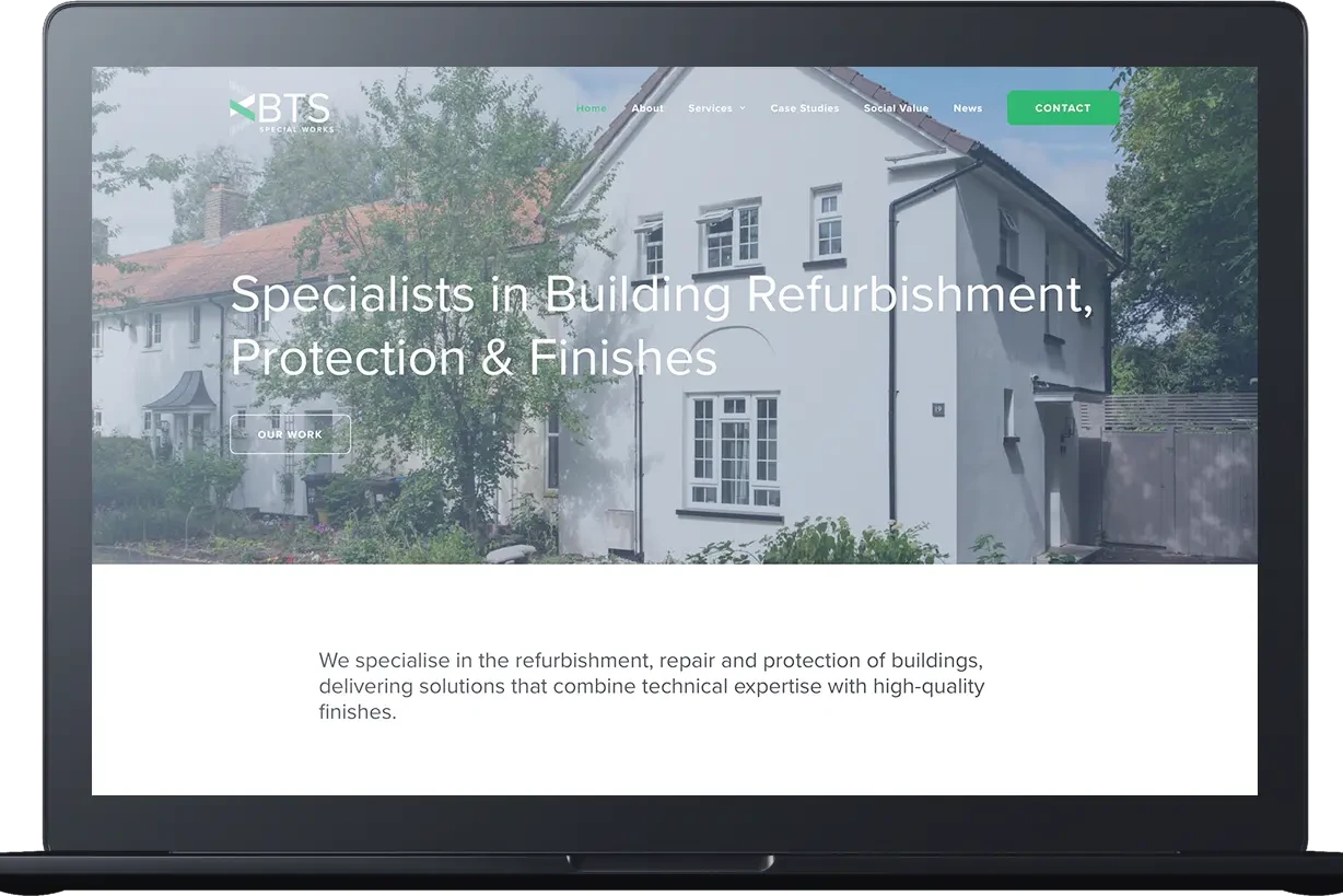 Laptop screen displaying a website for a building refurbishment company, featuring a photo of a white house and text highlighting their Special Works and BTS services.